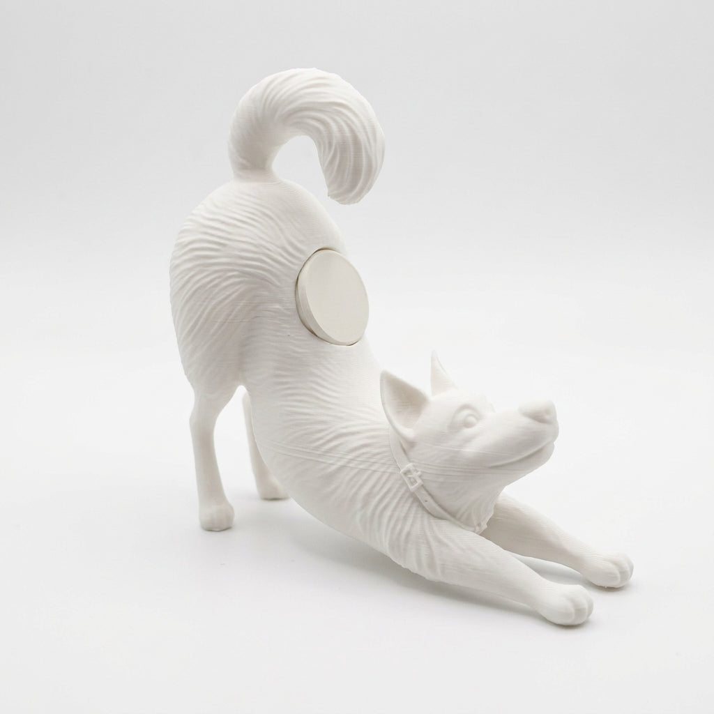 Smartwatch on a stand with a white dog figurine