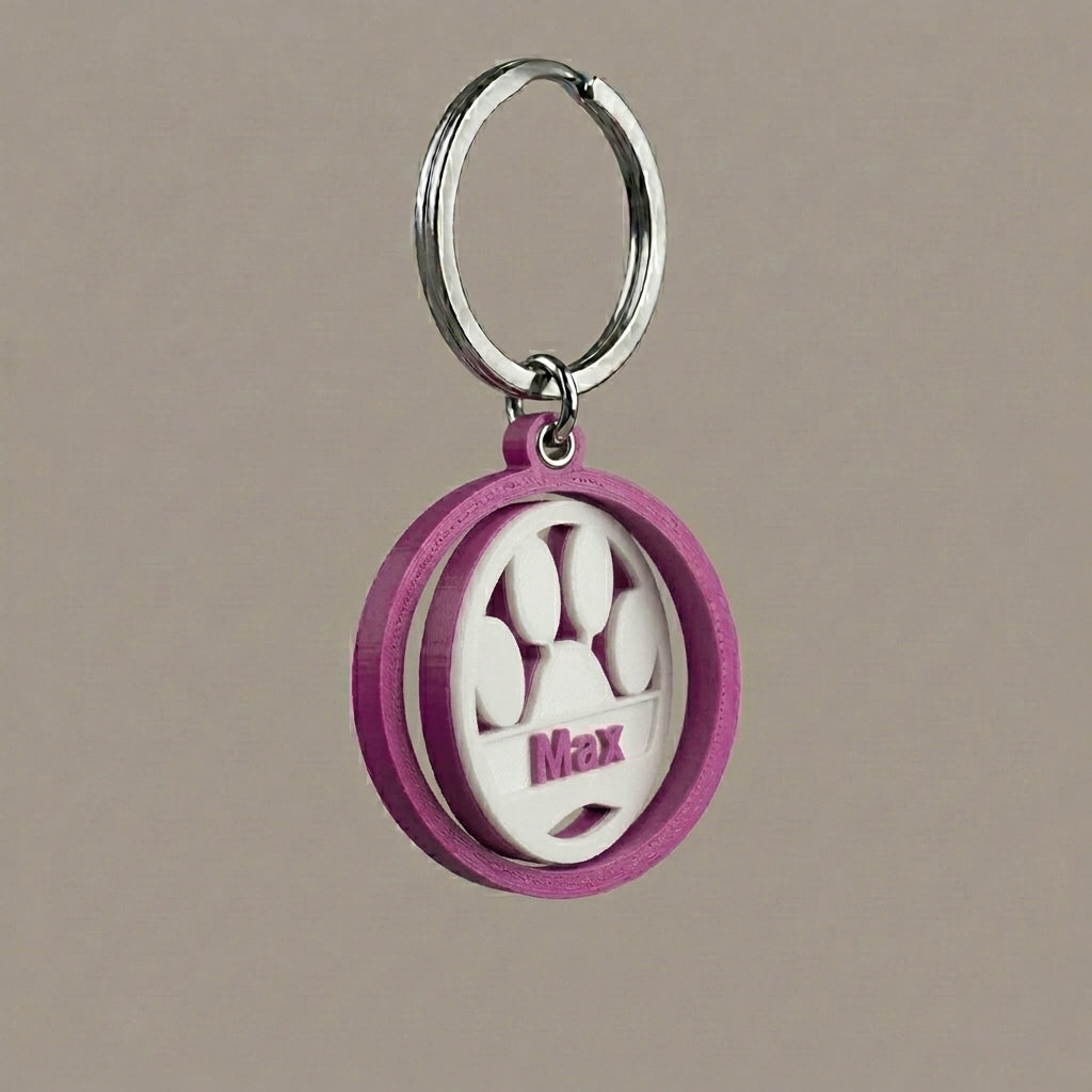 Keychain with paw print design and name engraved
